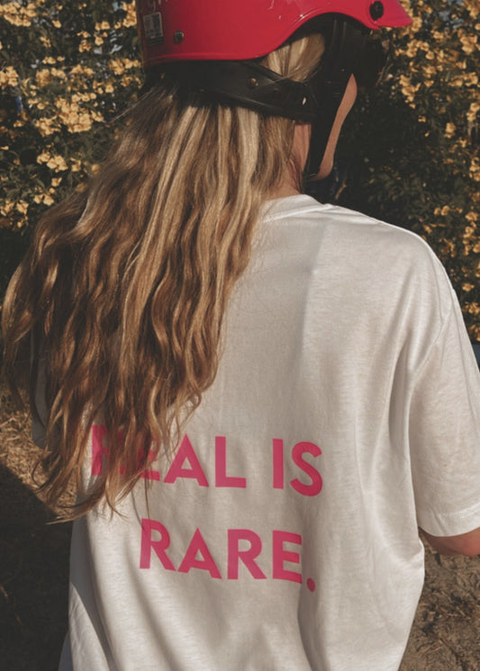 Unisex Relaxed T-Shirt “REAL IS RARE.” (Neon Pink Print)